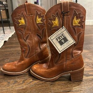 Frye cowboy boots. Hardly worn. Cognac coloring with brown and yellow accents.